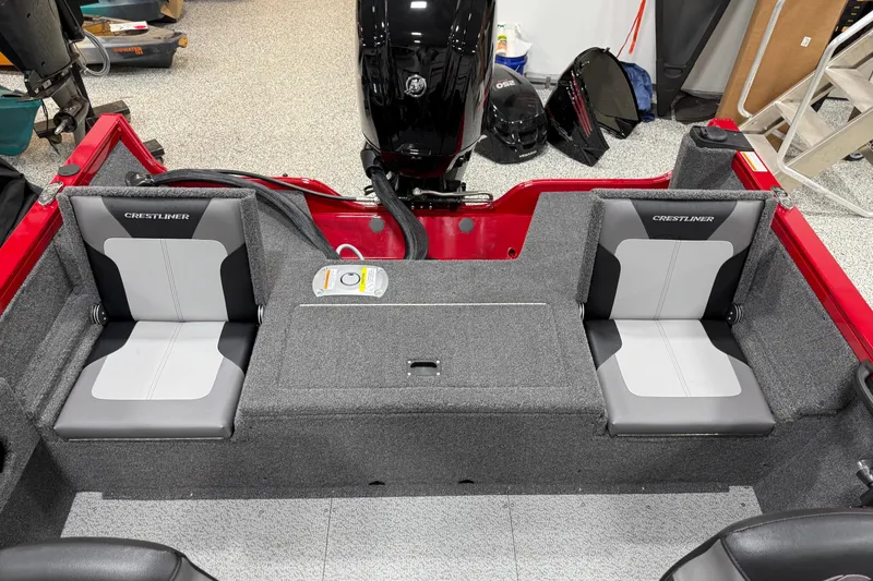 Slide: The Image of 2025 Crestliner 1650 Hawk boat interior with gray seating and red accents. - 10