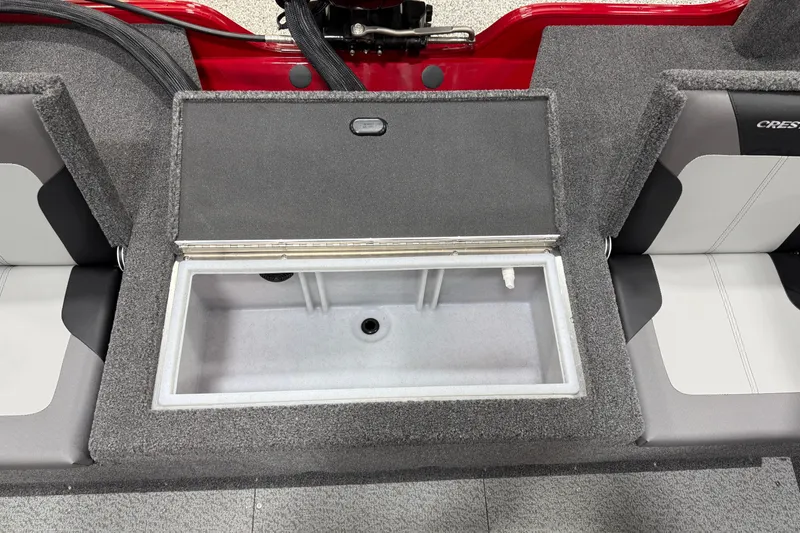 Slide: The Image of 2025 Crestliner 1650 Hawk boat interior with open storage compartment. - 11