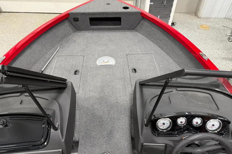 Slide: The Image of 2025 Crestliner 1650 Hawk boat interior with red trim and modern dashboard. - 4
