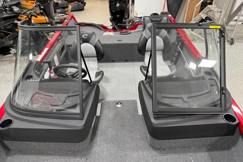Slide: The Image of 2025 Crestliner 1650 Hawk boat interior with dual seats and windshields. - 5