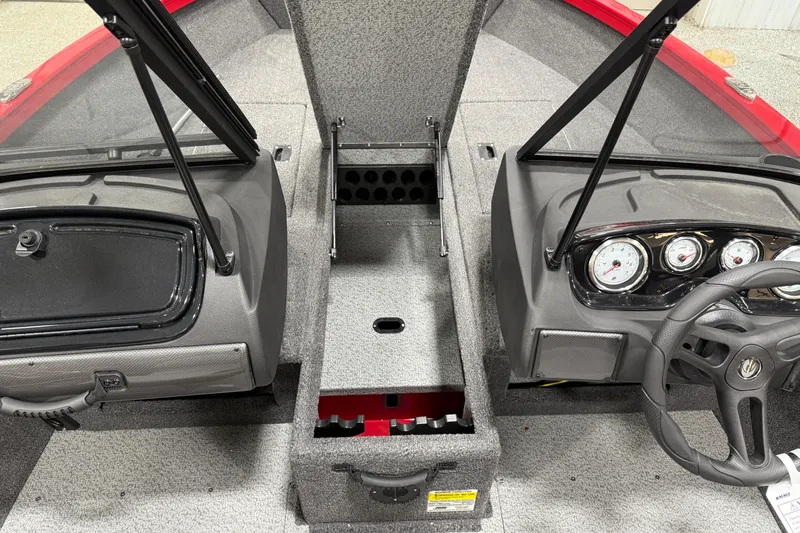 Slide: The Image of 2025 Crestliner 1650 Hawk boat interior with dual consoles and steering wheel. - 6