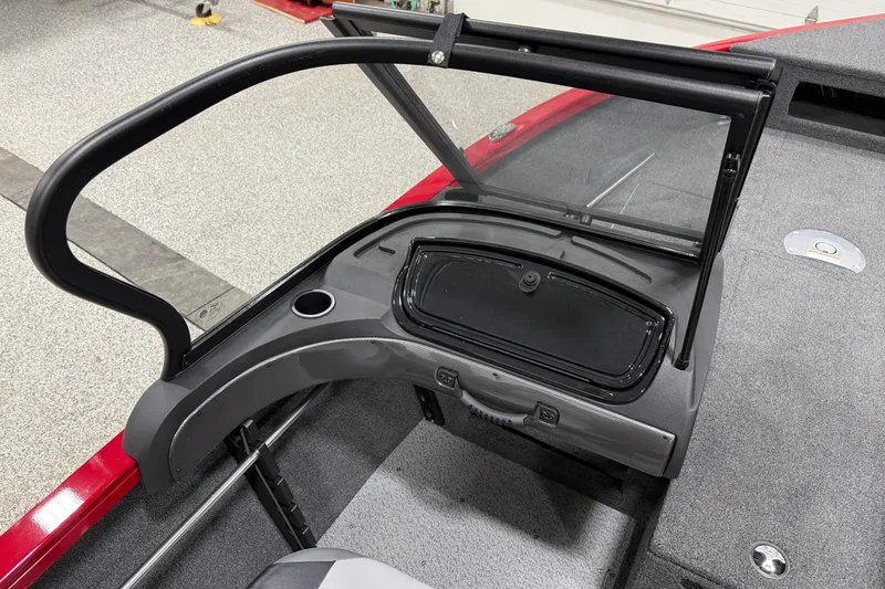Slide: The Image of 2025 Crestliner 1650 Hawk boat interior with windshield and storage compartment. - 8