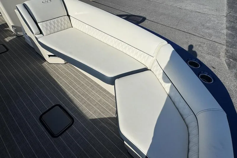 Slide: The Image of Luxurious seating on 2021 Harris Crowne SL 270 Twin Engine boat, featuring elegant upholstery. - 11