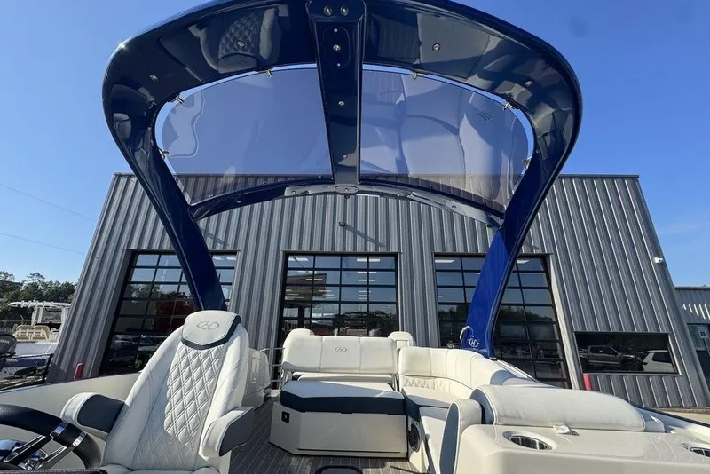 Slide: The Image of 2021 Harris Crowne SL 270 Twin Engine boat with luxurious seating and sleek design. - 13