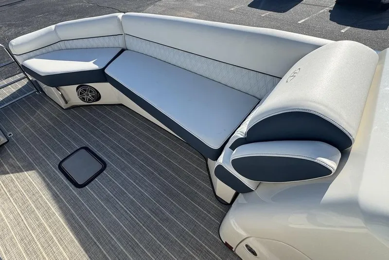Slide: The Image of Luxurious seating on 2021 Harris Crowne SL 270 Twin Engine boat, featuring elegant upholstery and speaker system. - 15