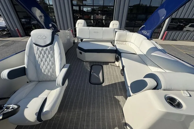 Slide: The Image of Luxurious interior of 2021 Harris Crowne SL 270 Twin Engine boat with plush seating. - 17