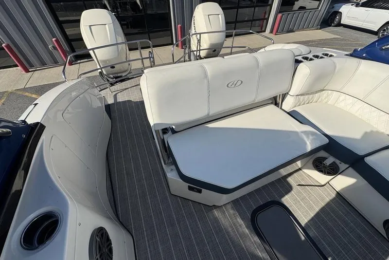 Slide: The Image of 2021 Harris Crowne SL 270 Twin Engine boat interior with white seating and modern design. - 19