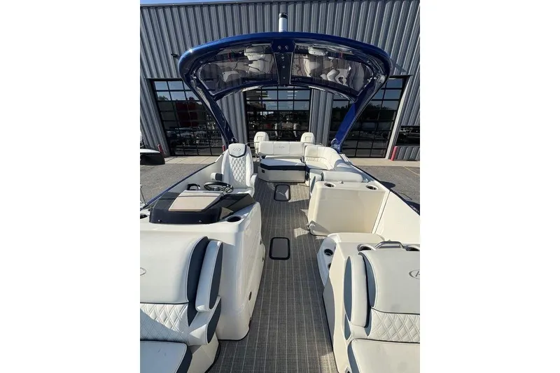 Slide: The Image of 2021 Harris Crowne SL 270 Twin Engine boat with luxurious seating and sleek design. - 8