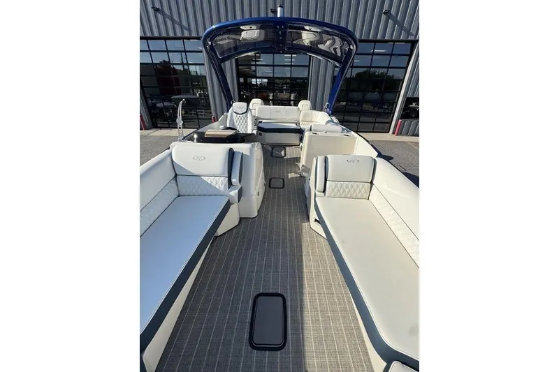 Slide: The Image of 2021 Harris Crowne SL 270 Twin Engine boat interior with luxurious seating and modern design. - 9