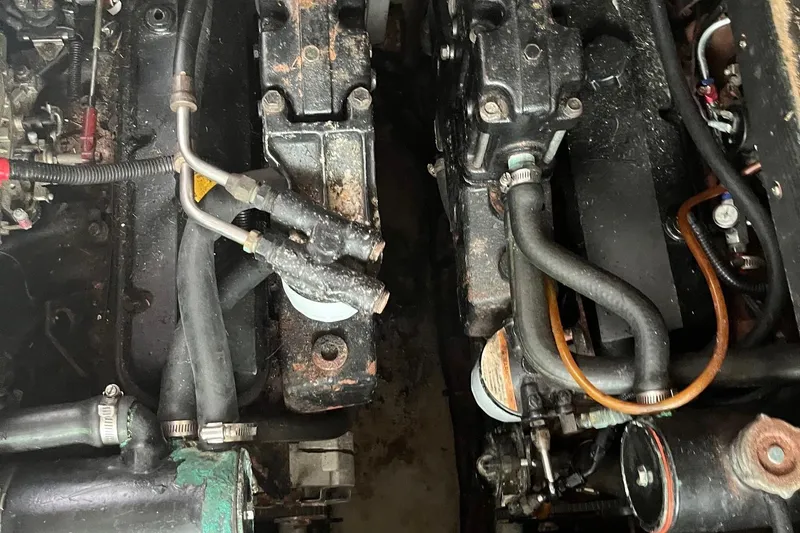 Slide: The Image of Engine components of a 1996 Sea Ray 370 Sedan Bridge, showing hoses and mechanical parts. - 15