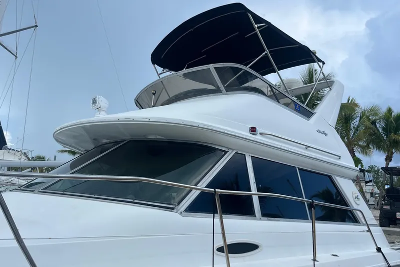 Slide: The Image of 1996 Sea Ray 370 Sedan Bridge yacht with sleek design and spacious upper deck. - 2