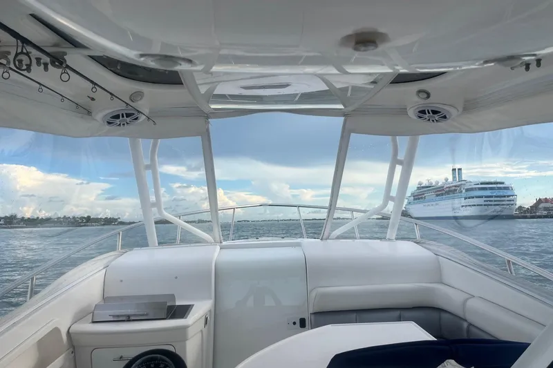 Slide: The Image of Interior view of 1996 Sea Ray 370 Sedan Bridge with ocean and cruise ship in background. - 3