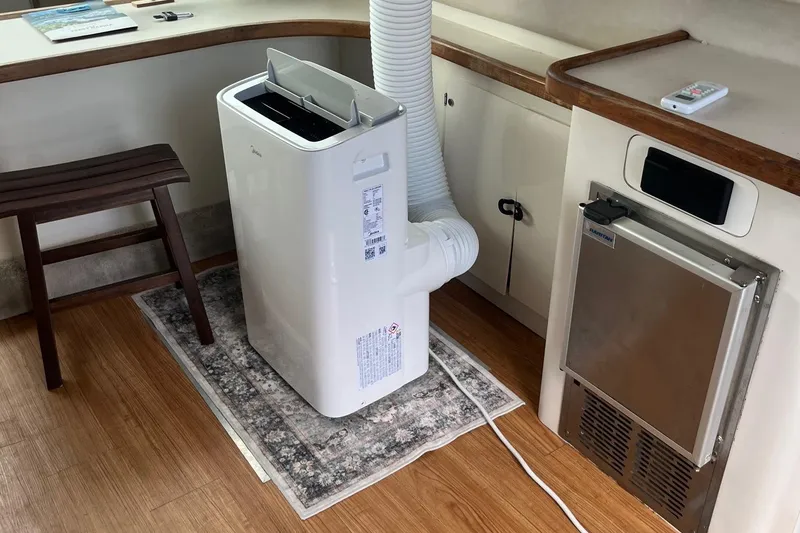 Slide: The Image of Portable air conditioner on a 1996 Sea Ray 370 Sedan Bridge yacht interior. - 5