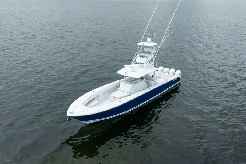 The Image of 2016 SeaHunter 45 boat on calm water, featuring a sleek design and multiple engines. - 1