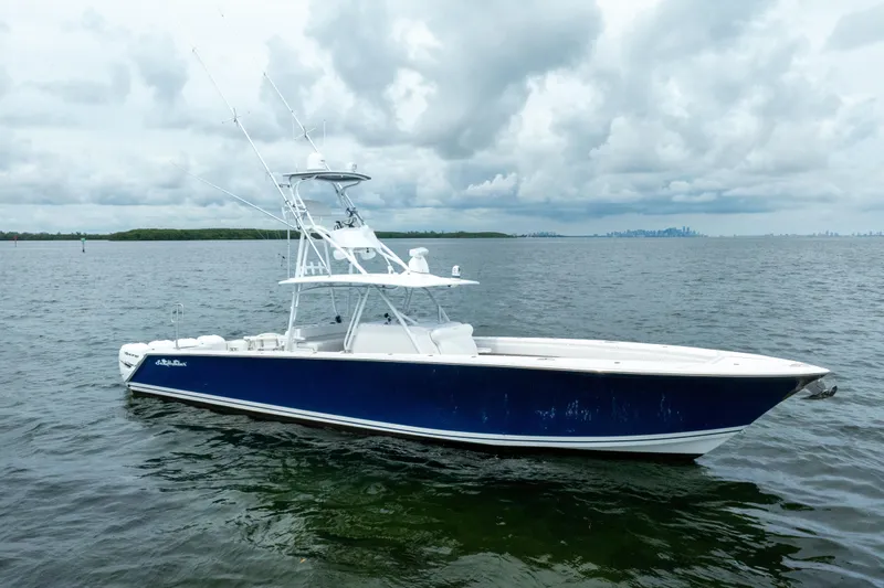 Slide: The Image of 2016 SeaHunter 45 boat on calm waters under cloudy skies. - 11