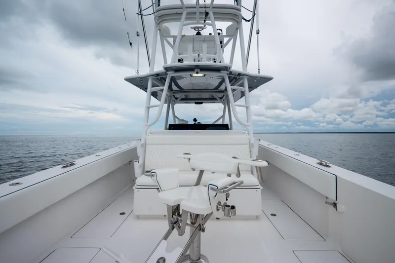 Slide: The Image of 2016 SeaHunter 45 boat with tower, on open water under cloudy sky. - 17