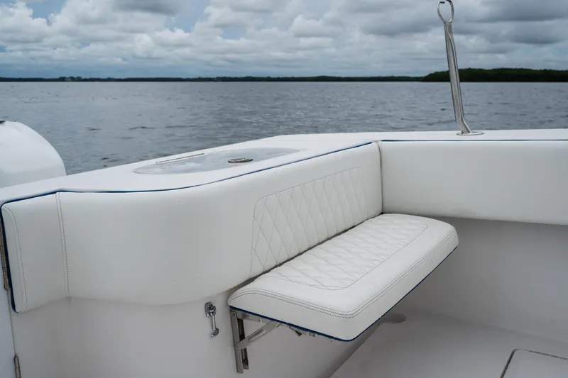 Slide: The Image of Luxurious seating on 2016 SeaHunter 45 boat with ocean view and cloudy sky. - 22