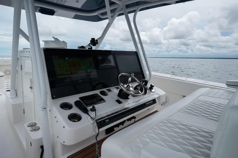 Slide: The Image of Helm of 2016 SeaHunter 45 boat with advanced navigation system and luxurious seating. - 26