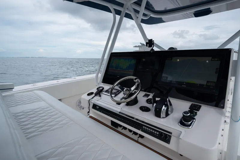 Slide: The Image of Cockpit of 2016 SeaHunter 45 boat with advanced navigation systems and ocean view. - 27