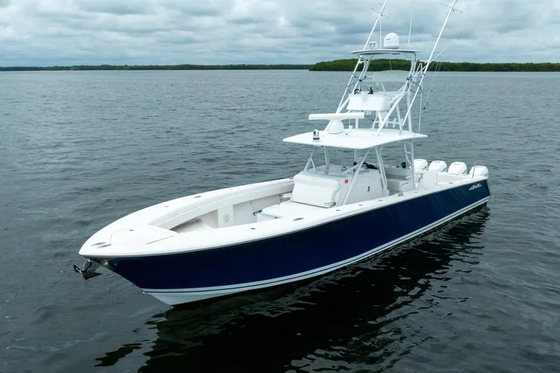 Slide: The Image of 2016 SeaHunter 45 boat on calm water, featuring sleek design and fishing equipment. - 3