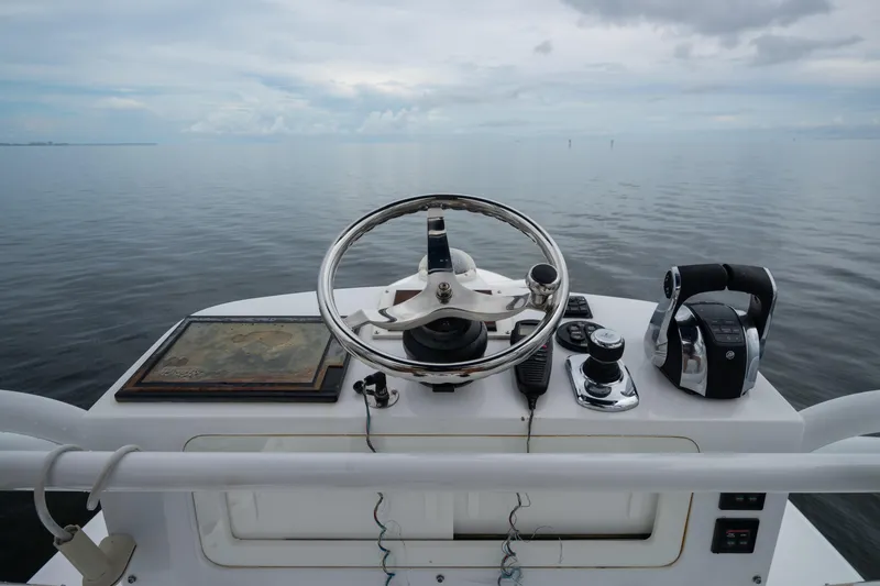 Slide: The Image of Steering console of 2016 SeaHunter 45 boat with ocean view. - 32
