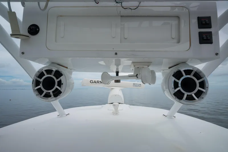 Slide: The Image of 2016 SeaHunter 45 boat with speakers and Garmin radar on calm water. - 33