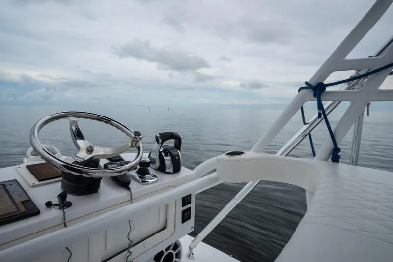 Slide: The Image of Helm of 2016 SeaHunter 45 boat with ocean view and cloudy sky. - 34