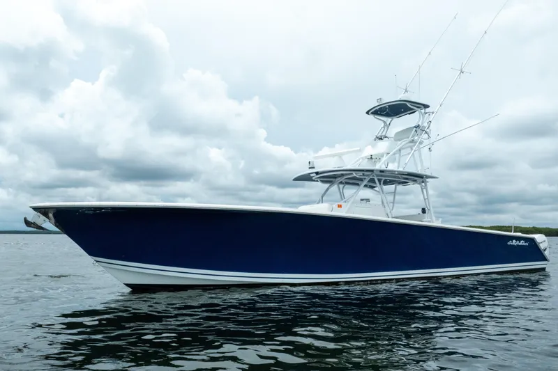 Slide: The Image of 2016 SeaHunter 45 boat on water under cloudy sky. - 6