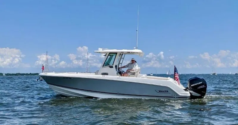 The Image of 2020 Boston Whaler 280 Outrage boat cruising on open water under a clear sky. - 0