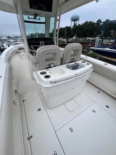 Slide: The Image of 2020 Boston Whaler 280 Outrage boat interior with seating and console. - 12
