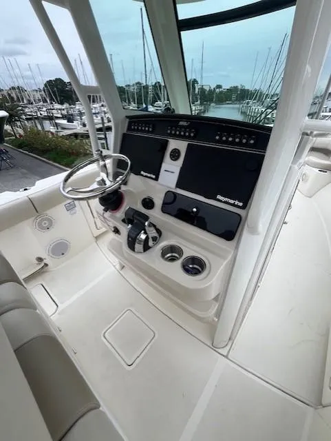 Slide: The Image of 2020 Boston Whaler 280 Outrage helm with modern controls and steering wheel. - 14