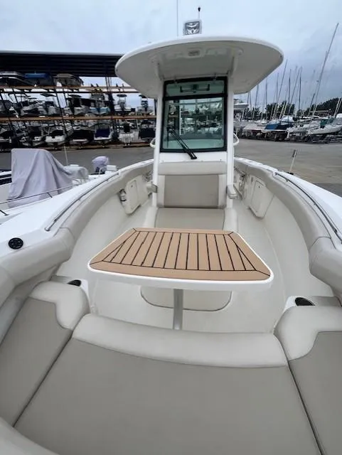 Slide: The Image of 2020 Boston Whaler 280 Outrage boat interior with seating and table. - 22