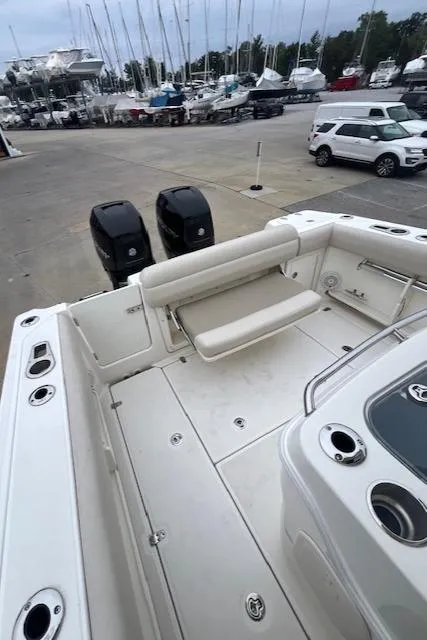 Slide: The Image of 2020 Boston Whaler 280 Outrage boat with dual engines at a marina. - 9