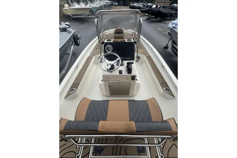 Slide: The Image of 2026 Xpress H22B Bay boat interior with steering console and seating. - 16
