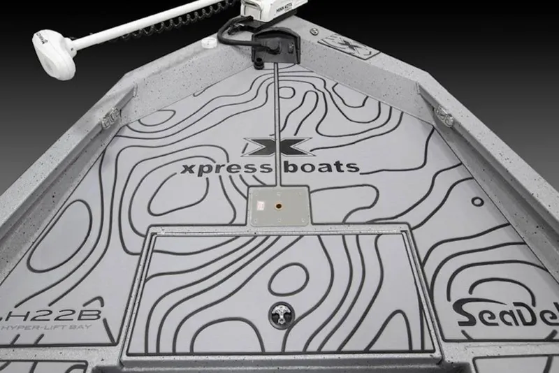 Slide: The Image of 2026 Xpress H22B Bay boat deck with SeaDek, featuring contour design and branding. - 32