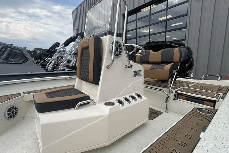 Slide: The Image of 2026 Xpress H22B Bay boat interior with modern seating and console design. - 9