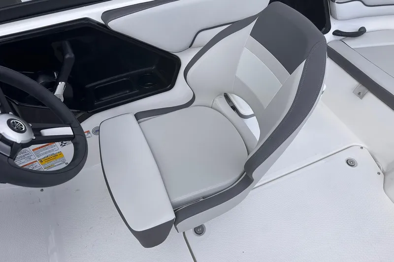Slide: The Image of 2025 Yamaha Boats AR190 interior with sleek, modern seating and steering wheel design. - 13