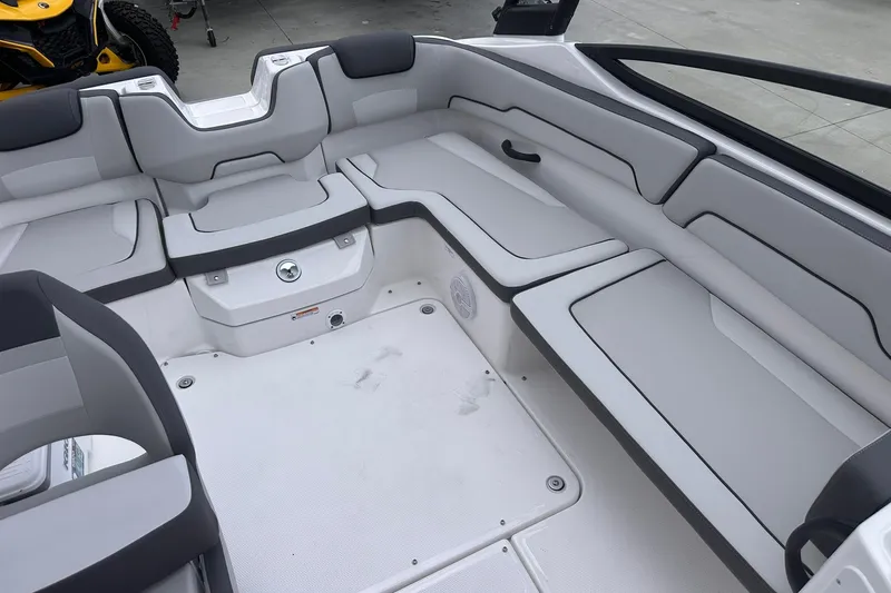 Slide: The Image of 2025 Yamaha Boats AR190 interior with sleek, modern seating and spacious layout. - 21