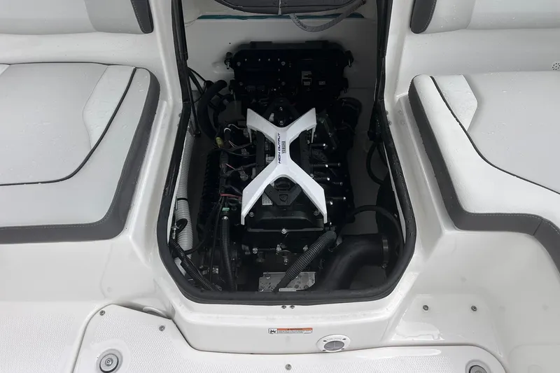 Slide: The Image of 2025 Yamaha Boats AR190 engine compartment with visible components and seating area. - 24