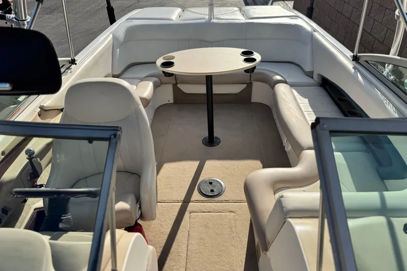 Slide: The Image of 2002 MasterCraft MariStar 230 VRS boat interior with seating and table. - 11