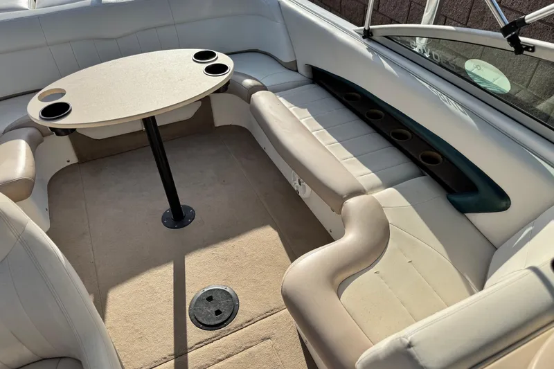 Slide: The Image of 2002 MasterCraft MariStar 230 VRS boat interior with seating and table. - 12