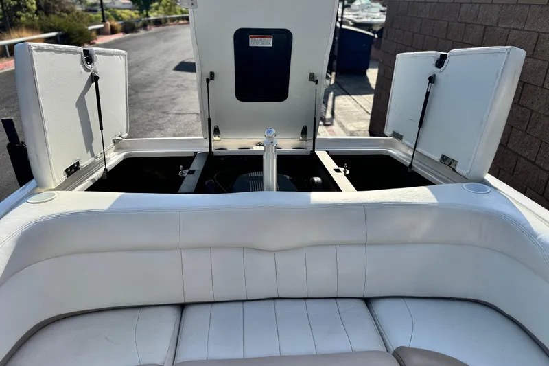 Slide: The Image of 2002 MasterCraft MariStar 230 VRS boat interior with open storage compartments. - 14