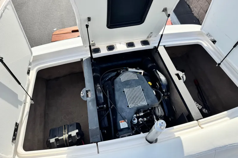Slide: The Image of 2002 MasterCraft MariStar 230 VRS engine compartment with open hatches, showcasing the engine. - 15