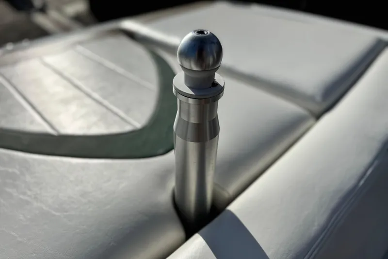 Slide: The Image of 2002 MasterCraft MariStar 230 VRS boat detail with metal fixture on cushioned surface. - 17