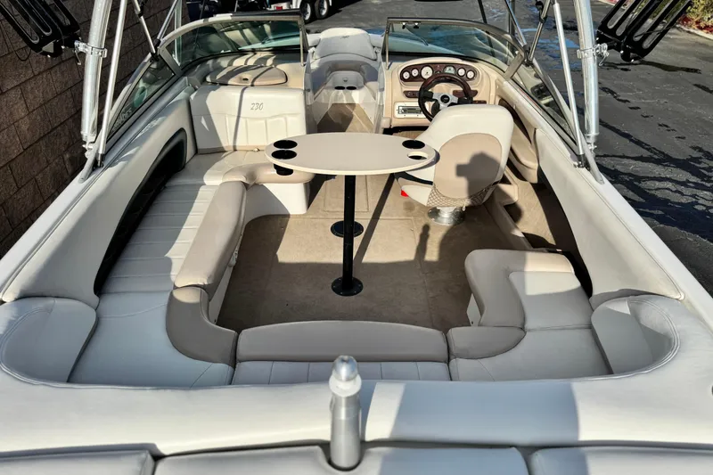 Slide: The Image of 2002 MasterCraft MariStar 230 VRS boat interior with seating and steering console. - 18