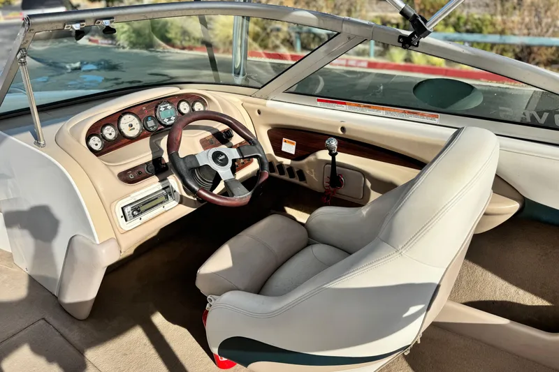 Slide: The Image of 2002 MasterCraft MariStar 230 VRS boat interior with steering wheel and dashboard controls. - 22