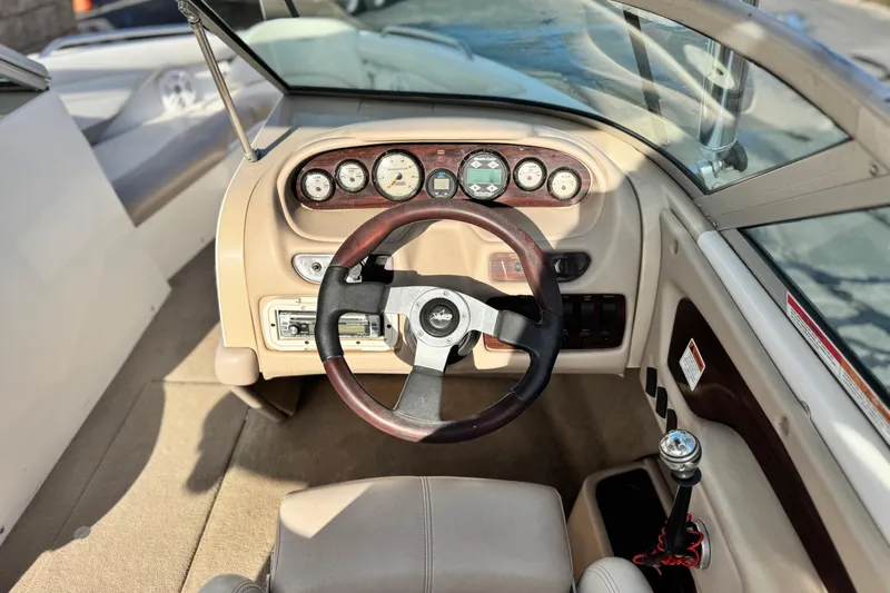 Slide: The Image of 2002 MasterCraft MariStar 230 VRS boat dashboard with steering wheel and gauges. - 23