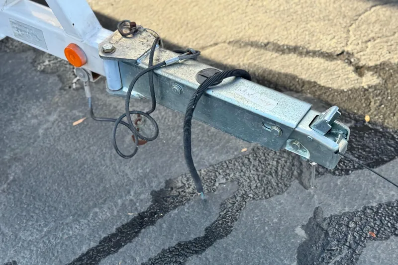 Slide: The Image of Trailer hitch of a 2002 MasterCraft MariStar 230 VRS on asphalt surface. - 27