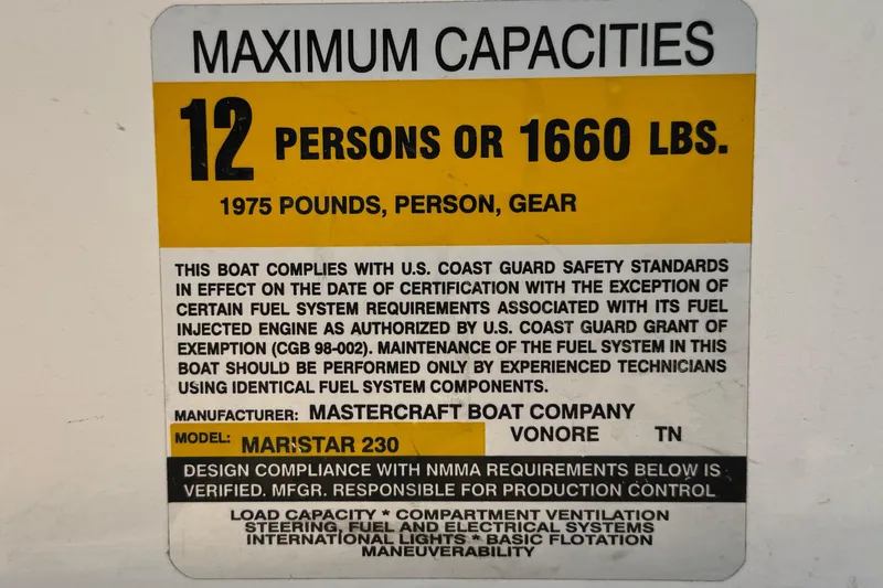 Slide: The Image of 2002 MasterCraft MariStar 230 VRS capacity label, 12 persons or 1660 lbs, U.S. Coast Guard compliant. - 28