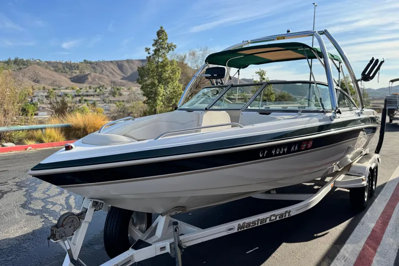 Slide: The Image of 2002 MasterCraft MariStar 230 VRS boat on trailer, scenic background. - 3